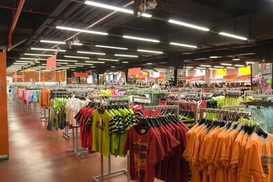 Lots of t-shirts in a shop