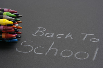 Back to school sign with crayons