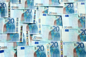 A background of lots of 20 Euro currency bank notes.