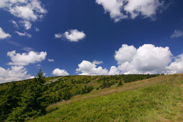 Hill and beautiful sky with clouds - summer in czech republic