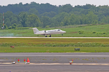Fototapeta na wymiar White Jet Touching Down
