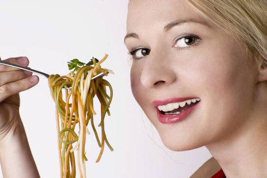 Smiling woman and her healthy diet.