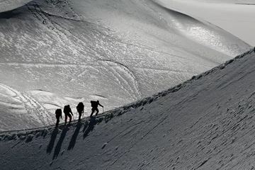 Foto op Aluminium Bergbeklimmers op het randje © philippe Devanne