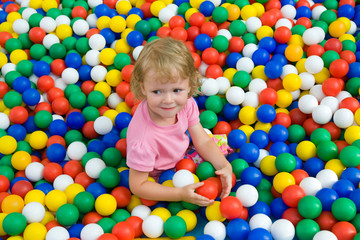 Fototapeta na wymiar girl with varicoloured balls