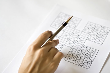 A hand on sudoku grid