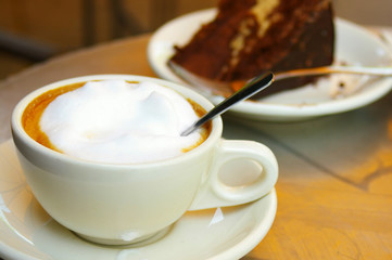 Cup of coffee and chocolate cake