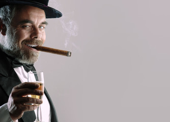 man with glass and cigar
