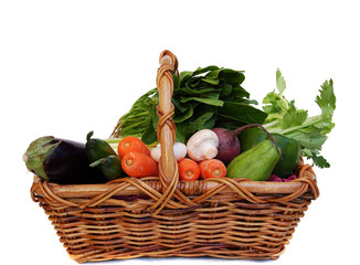 Vegetables in the basket isolated on white