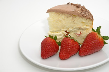 isolated right aligned dessert cake with strawberries
