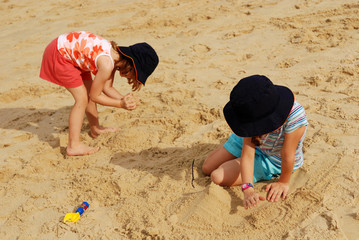 Children playing sands at the beach