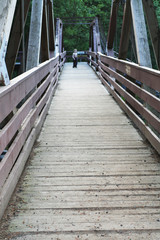 boy on a wooden bridge