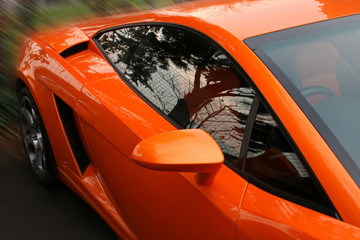 side of orange supercar