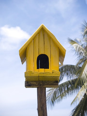 Yellow birdhouse