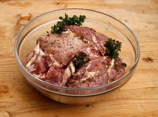 Pork steak marinated in olive oil with spices