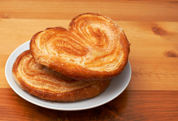 Palmier pastries on white saucer