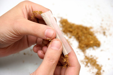 details of an person rolled cigarette