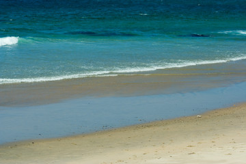Sea waves on tropical beach in natural harmony