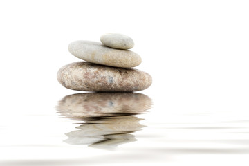 Pile of balanced stones on a white background