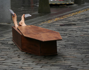 performer in coffin Edinburgh Festival