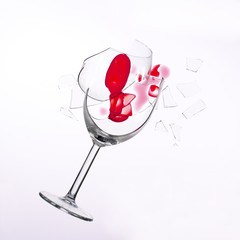 fallen wine glass with red wine in it