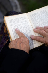 Fototapeta premium Senior's hands on old Bible