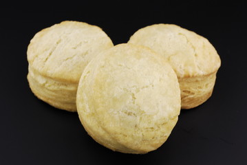 Buttermilk biscuits isloated on black