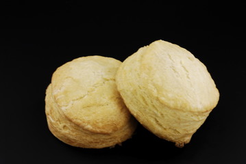 Buttermilk biscuits isloated on black