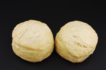 Buttermilk biscuits isloated on black