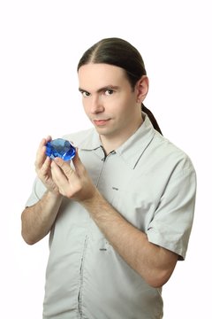 young man holding a crystal