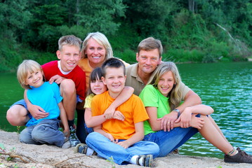 Happy family by the lake