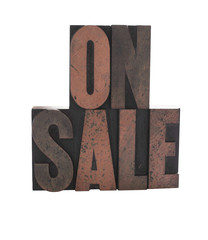 'on sale' in old wood letters