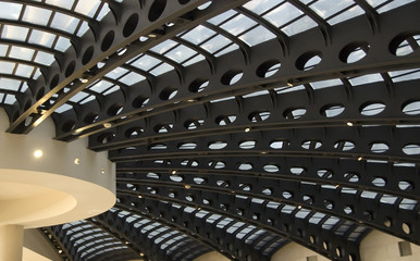 Interior of round dome with beams radiating from central column