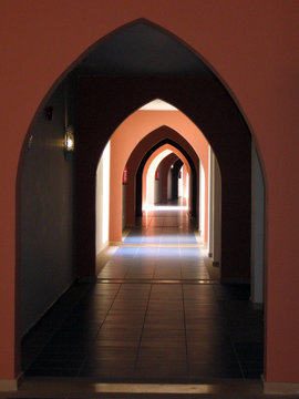 Infinite arches within arches form hallways