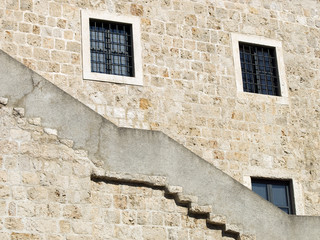 Dubrovnik city walls detail. Windows and stairs.
