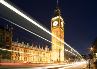 Fototapeta premium Big Ben in London at night against blue sky. London traffic