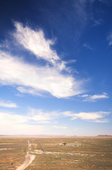Blue sky over a dry desert landscape