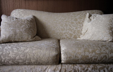 Detail of neutral patterned sofa in living room