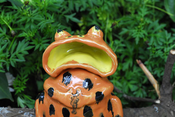 ceramic frog fountain in the gardens