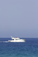Obraz na płótnie Canvas motor yacht cruising the corsican coast
