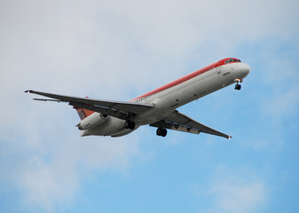 Airborne modern passenger airplane approaching destination
