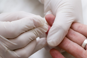 Close-up of a finger for the analysis of blood