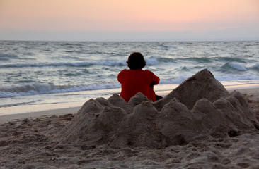 sand castle and human figure