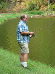 Man Fishing at a Lake