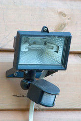 Outdoor security halogen light with IR movement sensor