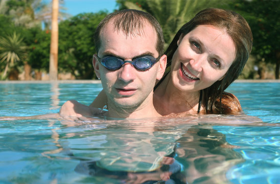 man and woman in the pool