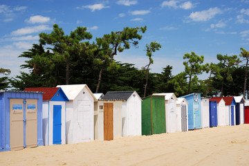 Fototapeta na wymiar Coloured Beach huts under the sunlight I