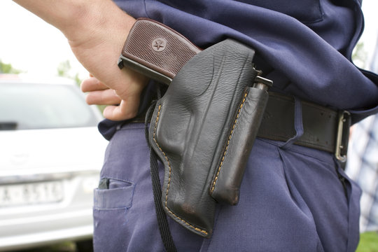 Police officer`s holster with gun.
