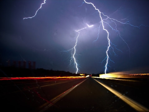 Twin lightning bolts strike highway