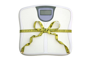 Concept: Scale with tape measure tied in a bow.