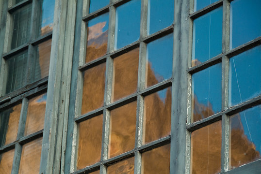 Colonial Window Panes with brick building reflected